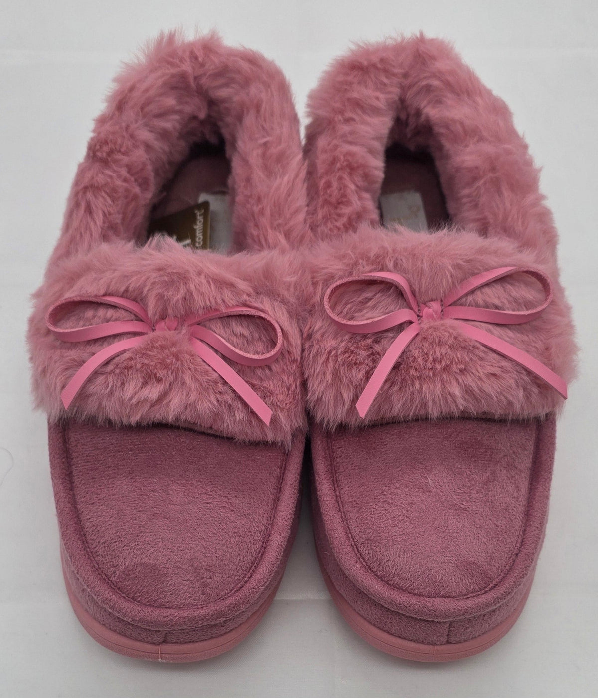 Pink faux fur moccasin slippers with satin bow detail